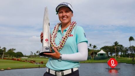 Brooke Henderson holds the trophy after winning the LPGA Lotte Championship golf tournament Saturday, April 14, 2018, in Kapolei, Hawaii. With three more wins, she'd break the Canadian professional golf record. LPGA Tour Golf brooke henderson