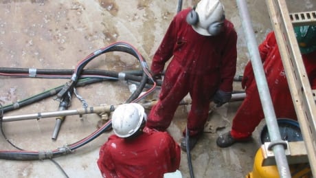 Workers check pipes on February 5, 2008 , looking for rust, aboard the FPSO Bonga (Floating, Production, Storage and Offloading), 120 kms off the coast of Nigeria, south of Lagos. Far from the Niger Delta and its separatist militants, the 305-meter long ship pumps night and day 225,000 barils of petrol a day and 150 million cubic feet of gas, which represents a quarter of the daily production of the Anglo-Dutch group Shell. Workers check pipes Nigeria