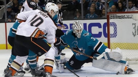 San Jose's Martin Jones stops a shot by Anaheim's Corey Perry during the second period of the Sharks' 2-1 Game 4 victory to clinch their first-round series against the Ducks. jones-martin-041818