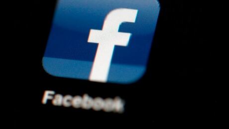 In this file photo, the Facebook logo is displayed on an iPad. Facebook Privacy Scandal
