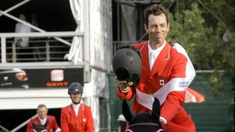 Jonathon Millar, right, seen here in this file photo from 2009, and his Canadian teammates sit atop the leaderboard heading into the third and final qualifying event for the Longines Nations' Cup final. jonathon-millar