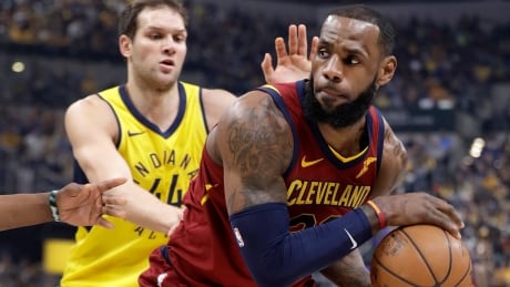 LeBron James, right, had a game-high 32 points as the Cleveland Cavaliers defeated the Indiana Pacers 104-100 to even up their first-round series. lebron-james