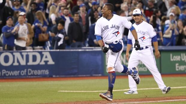 Curtis Granderson celebrates after hitting a game-winning solo home run in the 10th inning of the Blue Jays' 4-3 win against the Boston Red Sox on Tuesday. Curtis Granderson