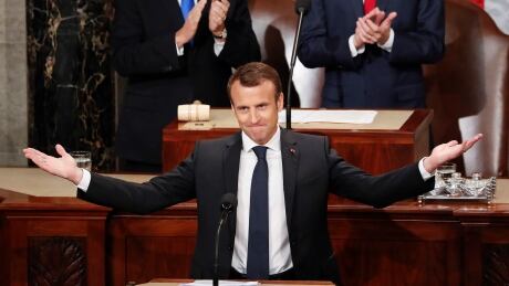French President Emmanuel Macron gestures as he is introduced before speaking to a joint meeting of Congress on Capitol Hill in Washington, Wednesday, April 25, 2018. US France