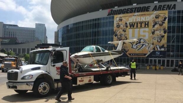 A small aircraft is loaded out front of Bridgestone Arena in Nashville prior to the Predators' second-round playoff series against the Winnipeg Jets. Nashville Predators smash plane