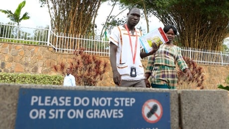 Visitors walk past a mass grave site at the Kigali Genocide Memorial Centre in Kigali in a 2014 file photo, 20 years after the genocide which killed an estimated 800,000 people. RWANDA/