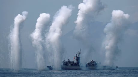 Flares are set off from Fong Yang Chi Yang class frigate during a drill near Yilan naval base, Taiwan, on April 13, 2018. TAIWAN-MILITARY/DRILLS