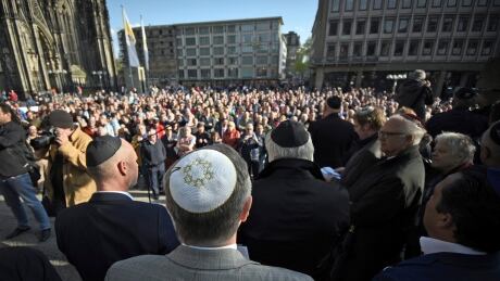 Men wear Jewish skullcaps, or kippa, as they attend a demonstration against anti-Semitism in Cologne on April 25. Germany Anti Semitism