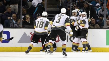 William Karlsson is congratulated by teammates Jonathan Marchessault, James Neal and Brayden McNabb after he scored the winning goal in overtime in the Vegas Golden Knights' 4-3 win over the the San Jose Sharks during Game 3 of their second-round playoff series in San Jose, Calif., on Monday. William Karlsson