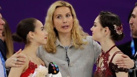 Russian figure skating coach Eteri Tutberidze, centres, says Olympic silver medallist Evgenia Medvedeva, right, has cut all ties with gold medallist Alina Zagitova, left. Figure Skating Russia Medvedeva
