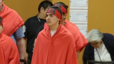 Jayden Bobb-Jollimore, centre, received the name Kuk?pi at a traditional naming
ceremony held at Seabird Island Community School this spring. It was the name of his uncle, Sonny, who died two years ago. Jayden Bobb-Jollimore