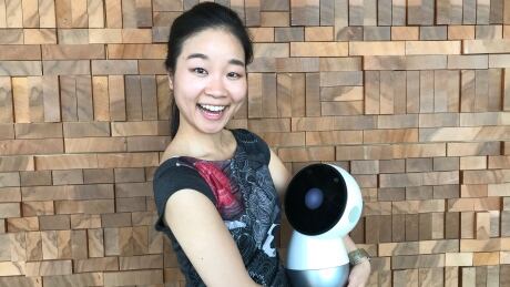 Robo-ethicist AJung Moon poses with Jibo the social robot. AJung Moon