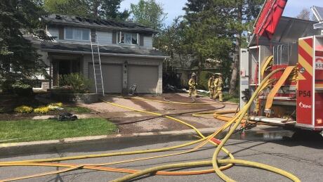 Firefighters extinguished flames at a home in Blackburn Hamlet Monday afternoon. Fire Northpark Drive Blackburn Hamlet