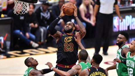 Cleveland Cavaliers' LeBron James drives to the basket against Boston's Terry Rozier in the third quarter during Game 4 on Monday night. celtics-cavaliers