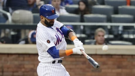 Former Blue Jays slugger Jose Bautista hits a double in his first at-bat after signing with the New York Mets on Tuesday. Marlins Mets Baseball