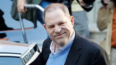 Film producer Harvey Weinstein arrives at the 1st Precinct in Manhattan in New York early Friday. PEOPLE-HARVEY WEINSTEIN/
