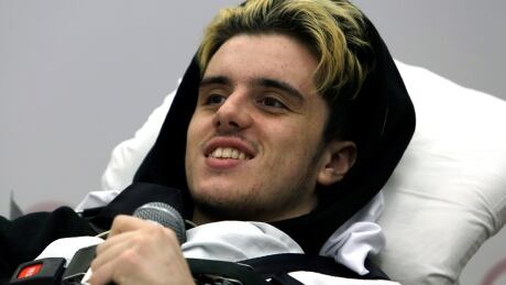 Ryan Straschnitzki smiles as he speaks to reporters at Shriners Hospitals for Children, Thursday in Philadelphia. Bus Crash Straschnitzki