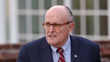 Former New York Mayor Rudy Giuliani arrives at the Trump National Golf Club Bedminster clubhouse, Sunday, Nov. 20, 2016, in Bedminster, N.J., for meetings with President-elect Donald Trump. Trump