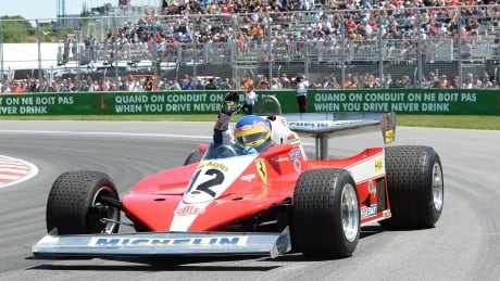 Former Formula 1 racer Jacques Villeneuve drives his father Gilles Villeneuve's 1978 Ferrari during the drivers' parade prior to the Canadian Grand Prix Sunday. CAR F1 Canada GP 20180610