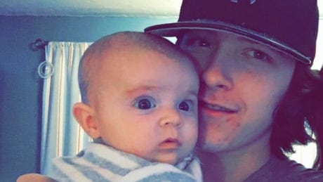 Joneil Hanna is shown with his baby daughter. Joneil Hanna