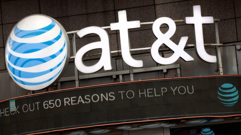 The AT&T logo is seen above a retail location.