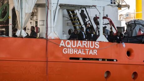 Migrants arrive on the NGO "SOS Mediterranee" Aquarius at the eastern port of Valencia, Spain, Sunday, Jun. 17, 2018. Ships in the Aquarius aid convoy docked Sunday at the Spanish port of Valencia, ending a week long ordeal for hundreds of people who were rescued from the perilous Mediterranean only to become the latest pawn in Europe's battle over immigration. (AP Photo/Olmo Calvo) Spain Europe Migrants