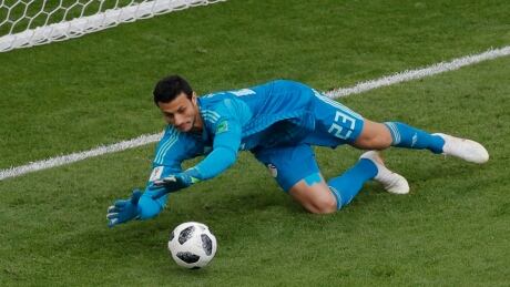 Egypt goalkeeper Mohamed Elshenawy stops a kick during the match between Egypt and Uruguay at the World Cup on Friday. egypt-soccer