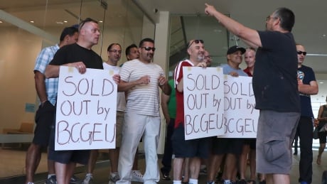 Shop steward Armando Rodriguez leads a group of youth correctional officers in a chant outside the BCGEU Lower Mainland office on Tuesday. BCGEU protest