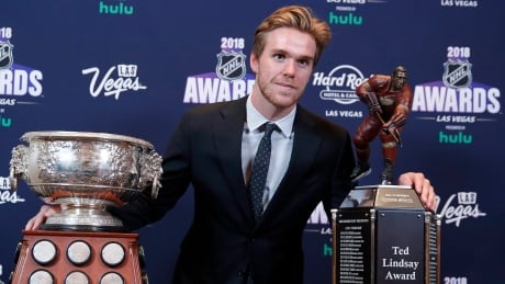 Edmonton Oilers' Connor McDavid poses with the Art Ross Trophy, left, and the Ted Lindsay Award at the NHL Awards on Wednesday. mcdavid-connor-2-062018