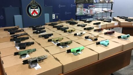 Toronto police seized dozens of firearms as a result of the raids. Seized guns