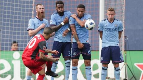 Sebastian Giovinco, front, and Toronto FC gave up two unanswered goals in the second half in a loss to New York City FC. Toronto FC New York City FC MLS June 24