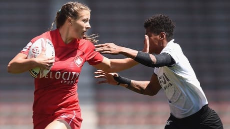 KITAKYUSHU, JAPAN - APRIL 21: Caroline Crossley of Canada is tackled by Miriama Naiobasali of Fiji on day one of the HSBC Women's Rugby Sevens Kitakyushu Pool match between Canada and Fiji at Mikuni World Stadium Kitakyushu on April 21, 2018 in Kitakyushu, Fukuoka, Japan. (Photo by Matt Roberts/Getty Images) crossley-caroline-1180