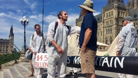 A group of protesters took to Parliament Hill on July 21, 2018, to convince the federal government to roll back its purchase of the Trans Mountain pipeline. parliament hill pipeline protest ottawa july 21 2018