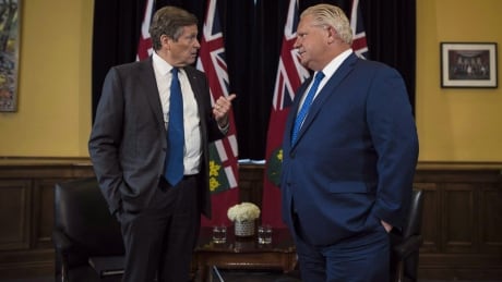 Ontario Premier Doug Ford and Toronto Mayor John Tory meet inside the Premier's office at Queen's Park in Toronto on Monday, July 9, 2018. A published report suggests the Ontario government is poised to reduce Toronto city council to just over half its current size. Toronto Mayor John Tory and Doug Ford