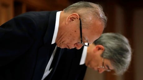 Tetsuo Yukioka, left , managing director of Tokyo Medical University, and Keisuke Miyazawa, vice-president of Tokyo Medical University, bow as they attend a news conference in Tokyo on Aug. 7, 2018. JAPAN-WOMEN/EXAMS