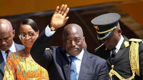 In this Thursday, June 30, 2016 file photo, Congolese President Joseph Kabila, centre, waves as he and others celebrate independence for the Democratic Republic of Congo in Kindu. A new candidate will emerge for the People's Party for Reconstruction and Democracy (PPRD), it was announced Wednesday. Congo Politics