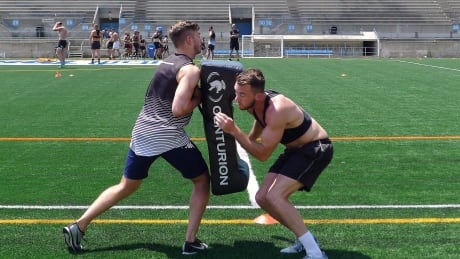 Wolfpack player Ryan Brierley, right, practices in Toronto in July. The Wolfpack begin their Super 8s Qualifiers schedule Sunday against Halifax RLFC. brierley-ryan-081018