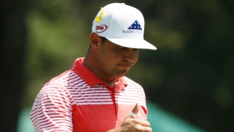 Gary Woodland gives a thumbs-up on the ninth green during the second round of the PGA Championship on Friday. woodland-gary