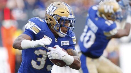 Winnipeg's Andrew Harris combined for 128 yards and one touchdown to help the Blue Bombers to a 29-23 win over the Hamilton Tiger-Cats on Friday.
Harris-Andrew-27072018