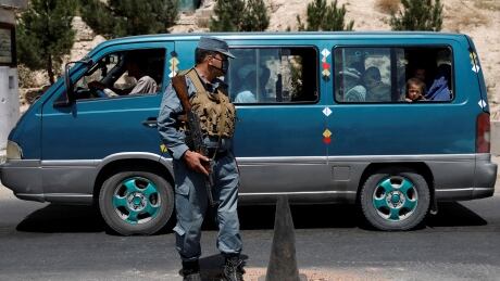 An Afghan policeman keeps watch at a checkpoint on the Ghazni highway, in Maidan Shar, the capital of Wardak province on Sunday. The instability comes with parliamentary elections scheduled for October.<br />
<br />
<br />
<br />
AFGHANISTAN-ATTACK/
