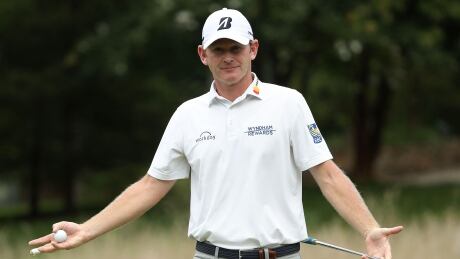Brandt Snedeker reacts after hearing thunder on the seventh green during the third round of the Wyndham Championship on Saturday. Snedeker holds a three-stroke lead going into the final round. Snedeker-Brandt-18082018