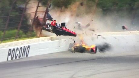 Canada's Robert Wickens, in the red car, went soaring into the fence at Pocono Raceway as part of a scary IndyCar wreck on Sunday. wickens-robert-081918