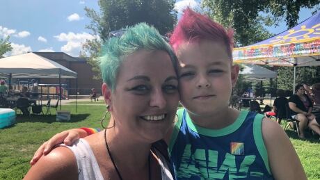 Margie Pepin and her son Samuel spent Sunday, Aug. 19, at a community picnic at Hintonburg Park, one the first of this week's Capital Pride events. mom and kid