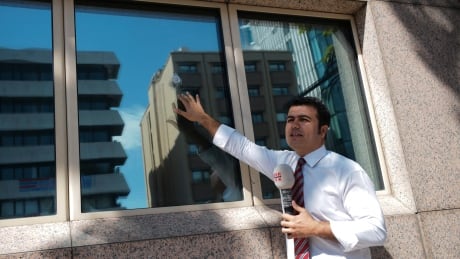 A journalist ,making a piece on camera, shows the damage to a security booth by a shot fired, outside the U.S. Embassy in Ankara, Turkey, Monday, Aug. 20, 2018. Shots were fired at a security booth outside the embassy in Turkey's capital early Monday, but U.S. officials said no one was hurt.Ties between Ankara and Washington have been strained over the case of an imprisoned American pastor, leading the U.S. to impose sanctions, and increased tariffs sent the Turkish lira tumbling last week. (AP Photo/Burhan Ozbilici) Turkey United States