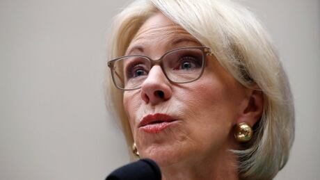 U.S. Education Secretary Betsy DeVos testifies at a House Committee on Education and the Workforce on Capitol Hill in Washington. Her department says it is weighing whether to allow states to use federal funds to purchase guns for schools. Guns In Schools