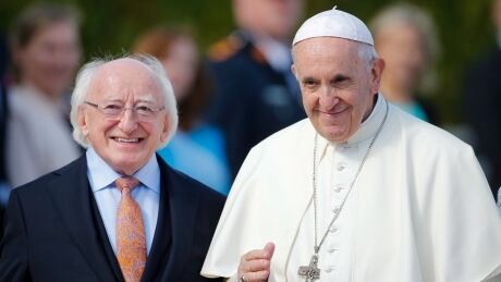Pope Francis, right, is flanked by Irish President Michael D. Higgins, upon his arrival at the Presidential residence in Dublin, Ireland, Saturday, Aug. 25, 2018. Pope Francis is on a two-day visit to Ireland. (AP Photo/Peter Morrison) Ireland Pope