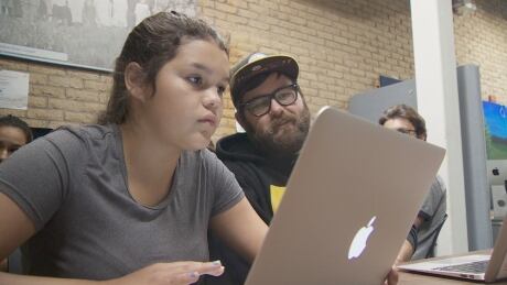 Isabella Perley, one of the students that's part of the program, is practicing her hand at writing Apple Swift code. brett bella - codersnorth