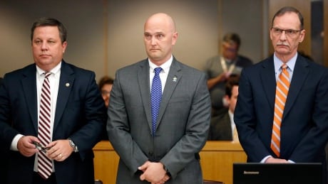 Fired Balch Springs police officer Roy Oliver, center, and his attorneys Miles Brissette, left, and Bob Gill stand before the reading of the verdict during Oliver's trial at the Frank Crowley Courts Building in Dallas on Tuesday, Aug. 28, 2018. Oliver was convicted of murder on Tuesday for fatally shooting an unarmed black teenager when he fired into a car full of teenagers leaving a house party in suburban Dallas. APTOPIX Texas Officer Murder Trial