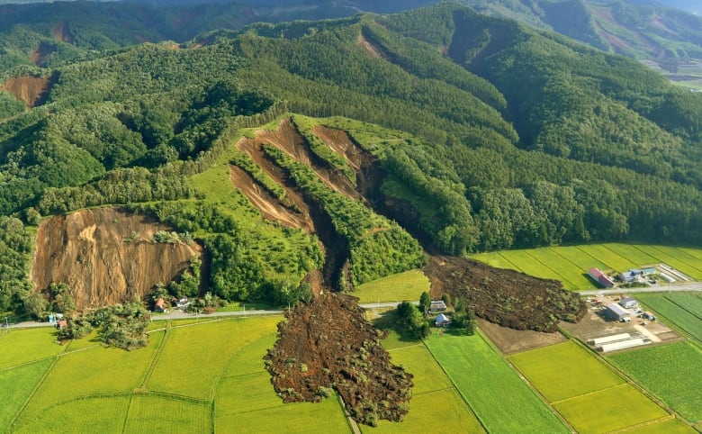 The quake triggered landslides, bringing down several houses. (AFP/Getty Images)