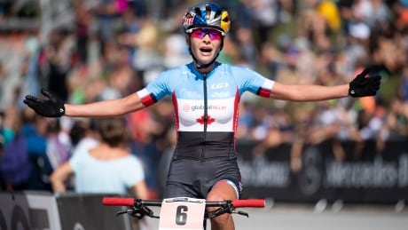 Bronze medallist Emily Batty of Canada reacts after the women's elite cross-country race at the UCI Mountain Bike World Championships in Lenzerheide, Switzerland, on Saturday. batty-emily-090818-620